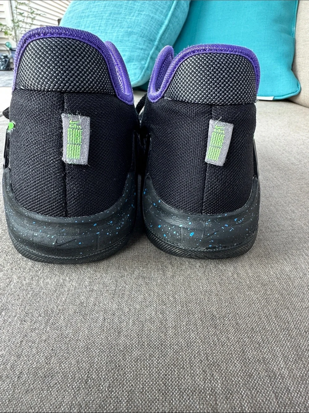 Nike Black Sneakers with Purple Lining and Green Swoosh
